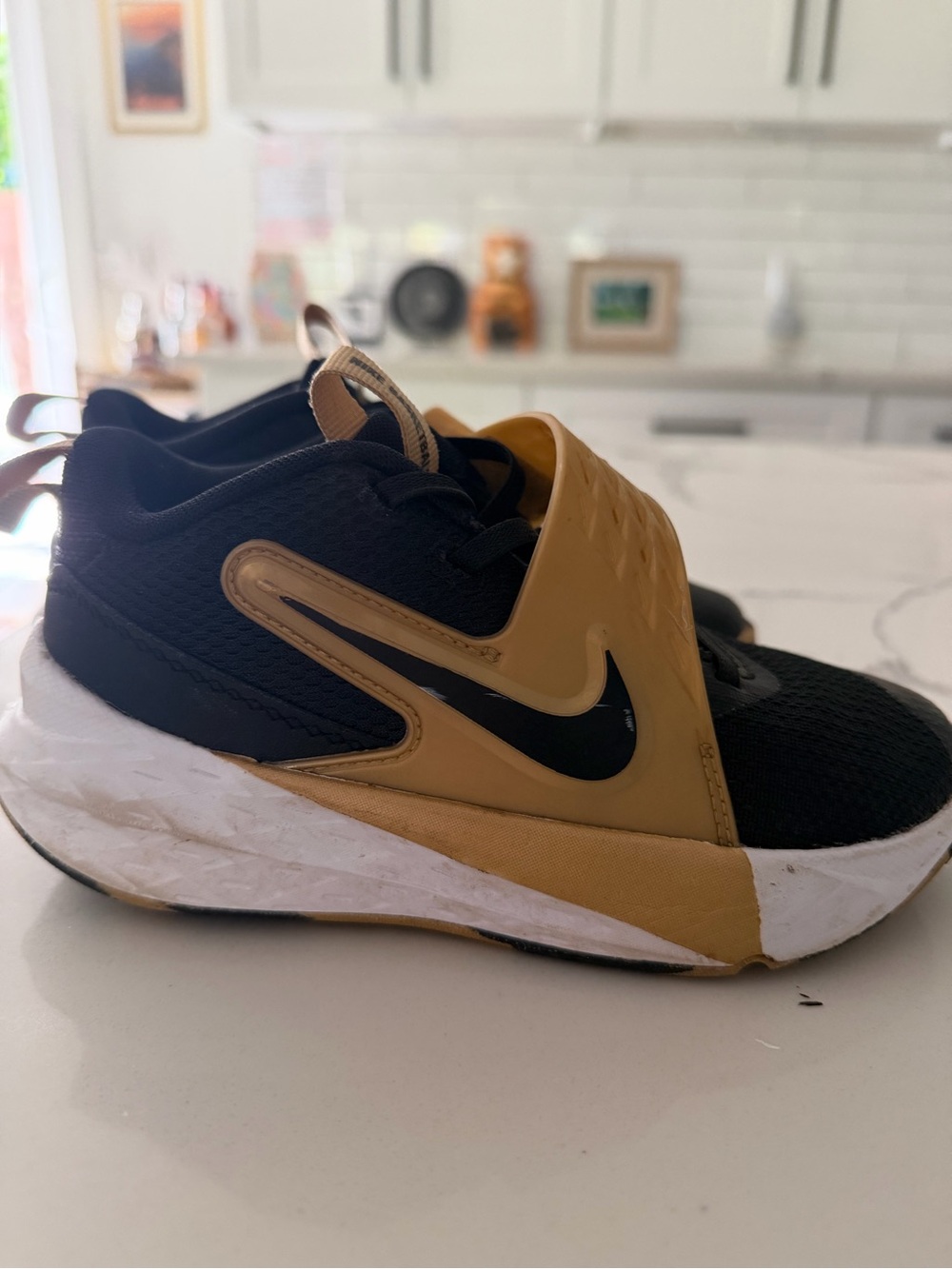 Nike Kids Black and Gold Slip-On Sneakers/basketball